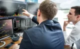 An Edward Jones analyst investigates strategies and opportunities for a client.